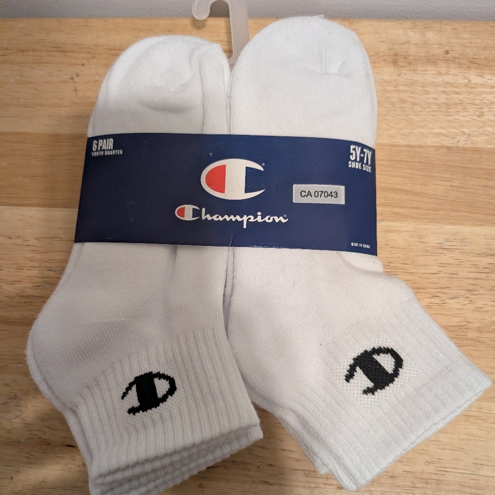 White Athletic Crew Socks with Cushioned Material and Champion Logo